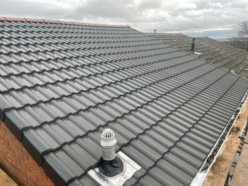 Gosforth Roofing team working on a pitched slate roof in Newcastle
