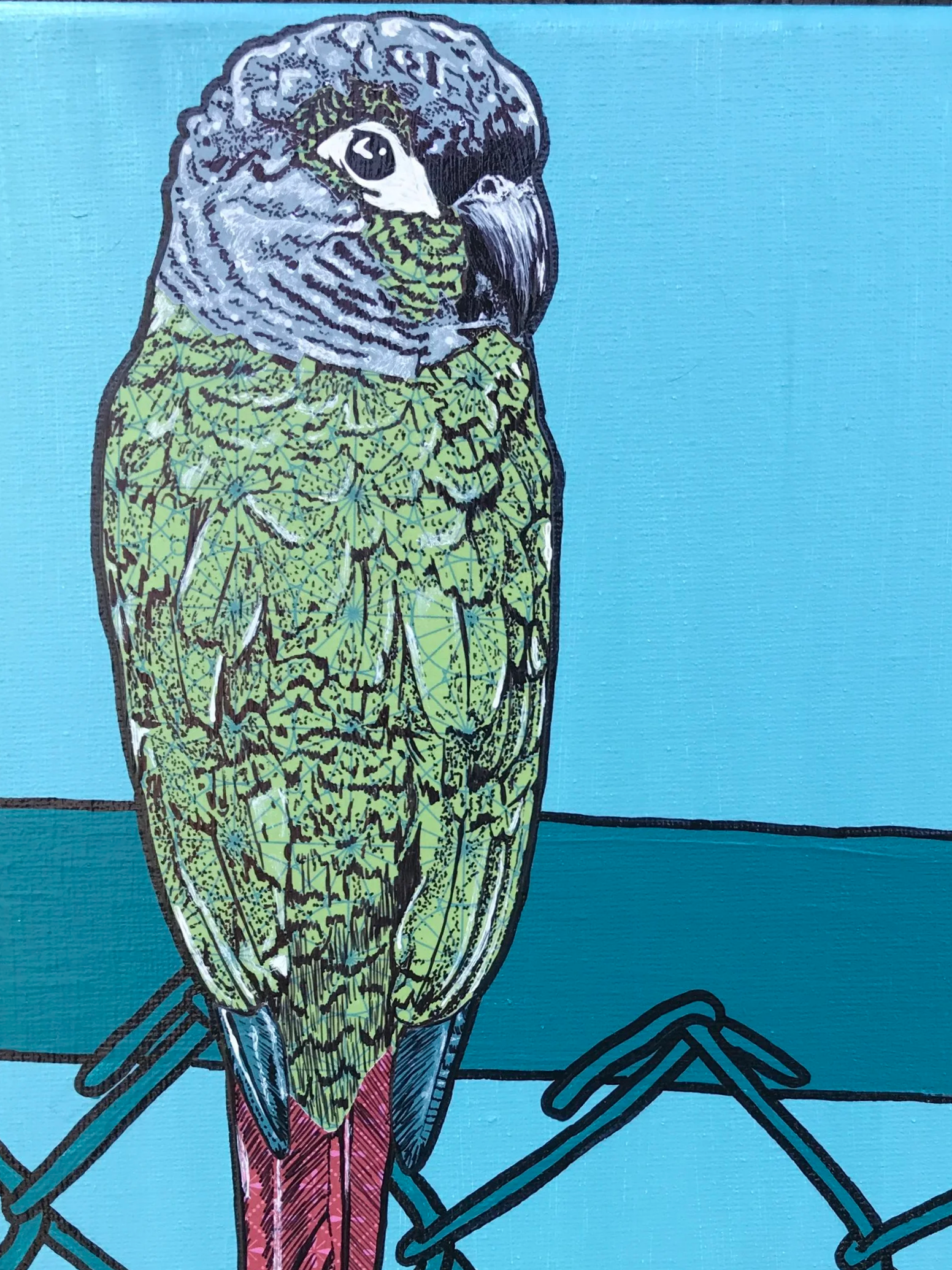 A collage of a parrot with a detailed, patterned body, sitting on a perch against a bright blue background.