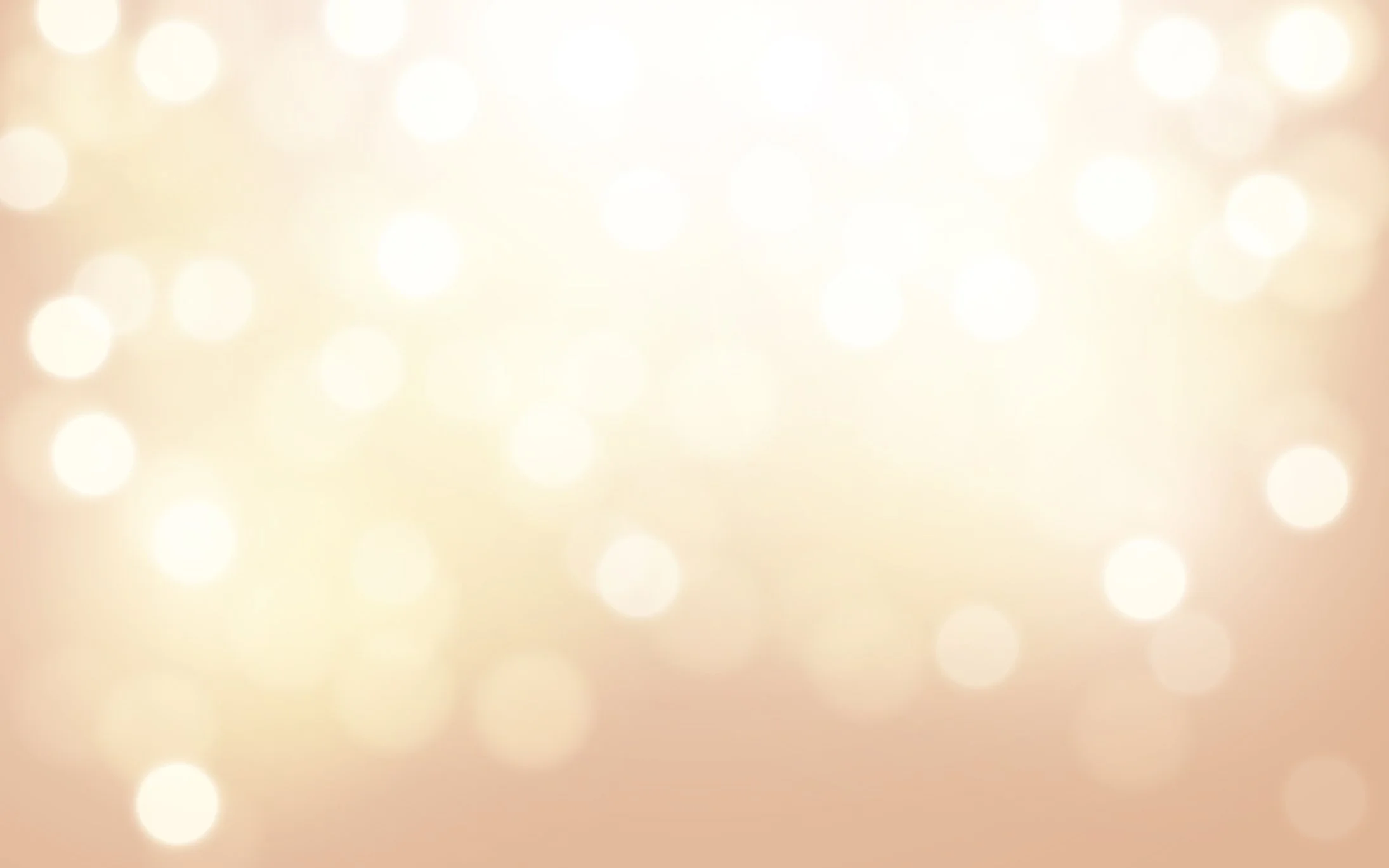 Blurred background with soft glowing lights in warm tones.