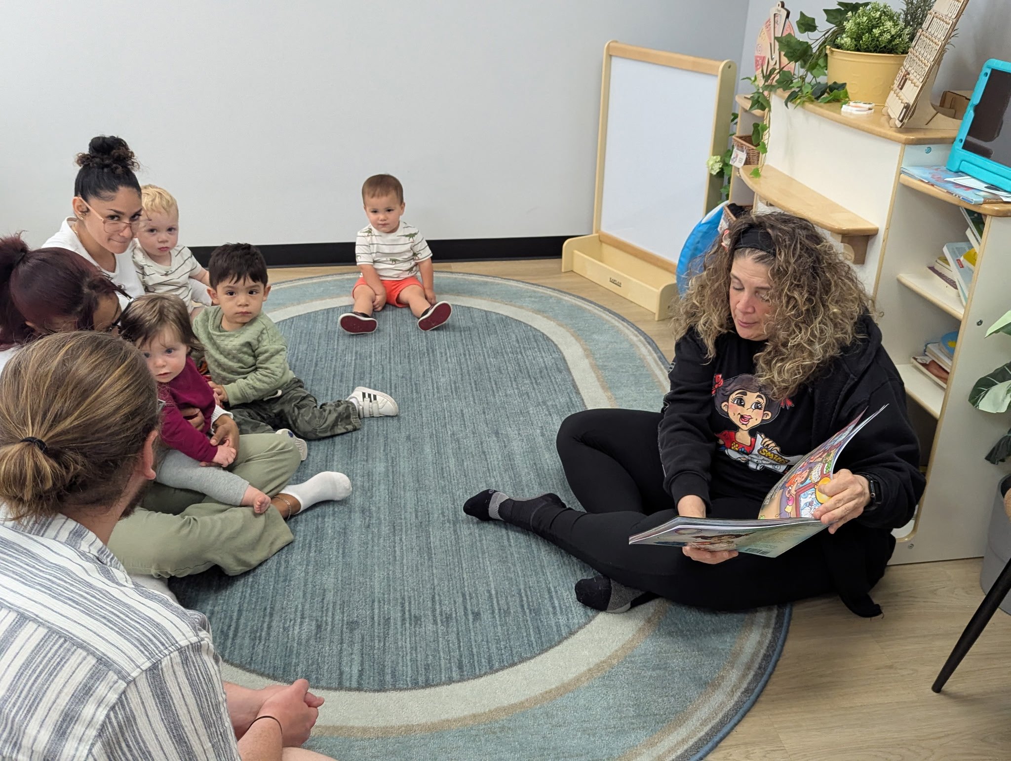 Claudia Colonna, author of children's book "Bajette's Balloon" pictured with children during her Magic of Smiles book tour. Claudia toured to various schools to read aloud to children.