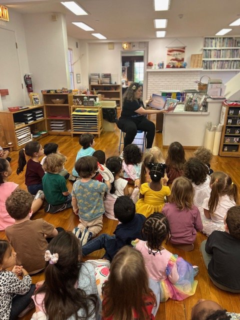 Claudia Colonna, author of children's book "Bajette's Ballon" pictured reading to children during her Magic of Smiles book tour.