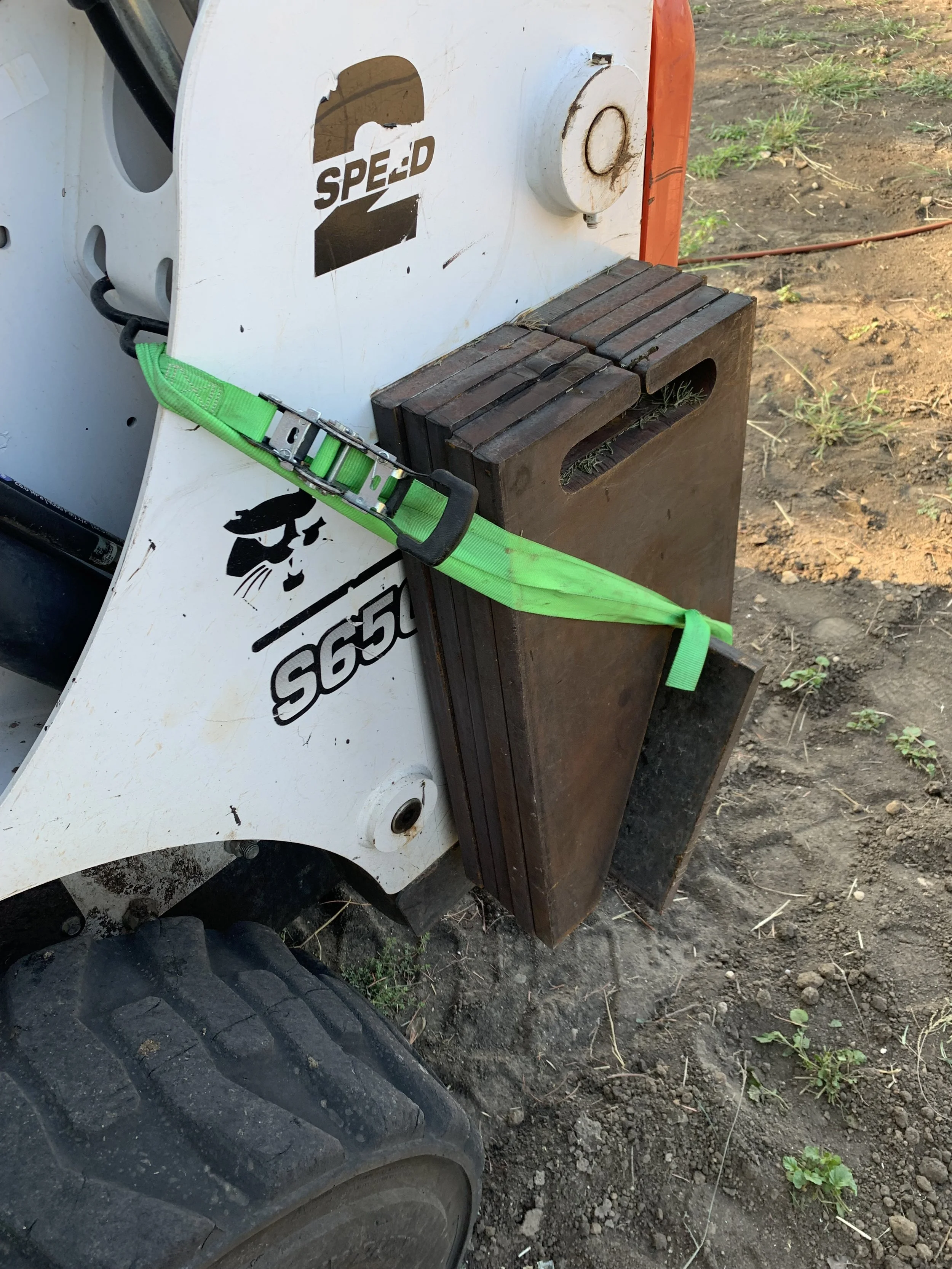 Skid steer with counterweight addition added to rear | John 6:9 Welding Company LLC | Sedalia, MO