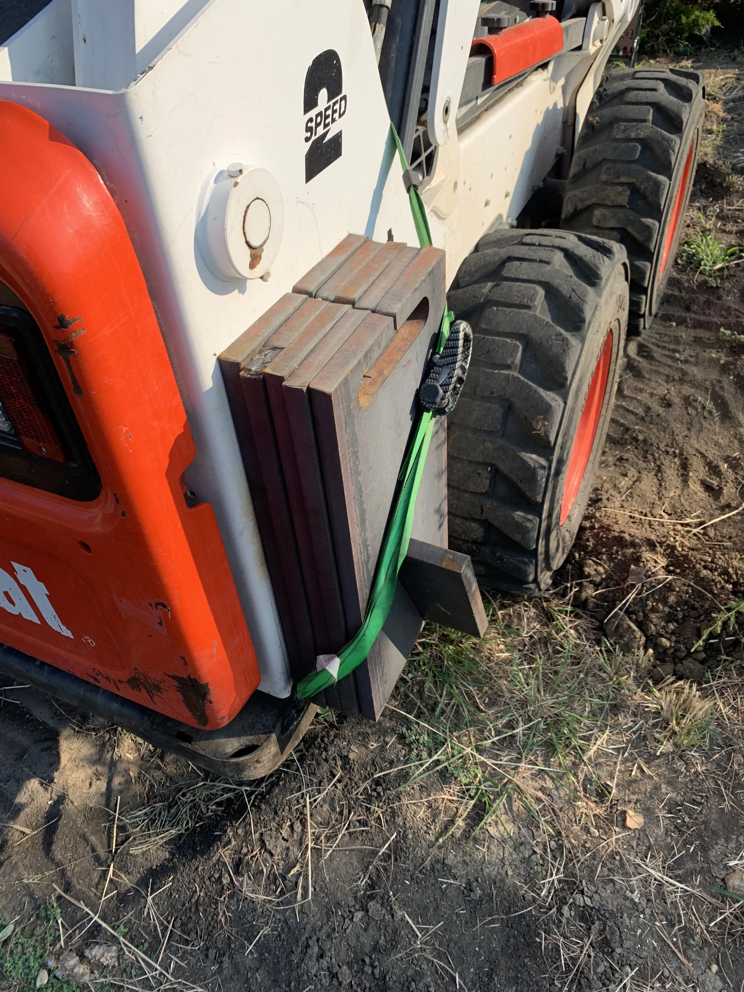 Skid steer with counterweight addition added to rear | John 6:9 Welding Company LLC | Sedalia, MO