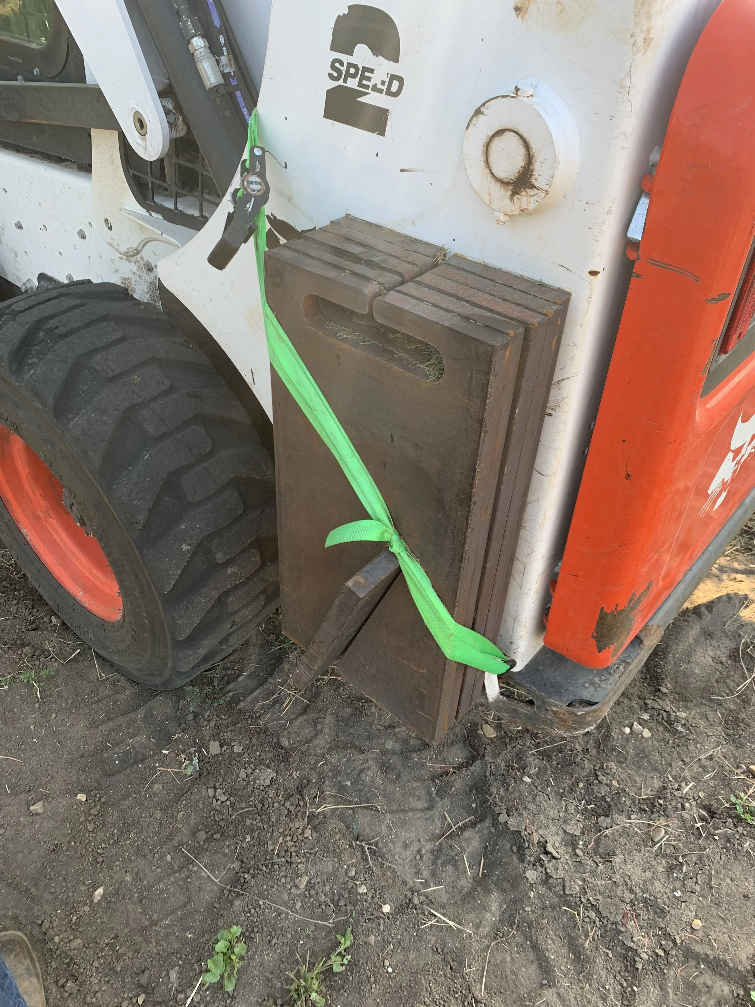 Skid steer with counterweight addition added to rear | John 6:9 Welding Company LLC | Sedalia, MO