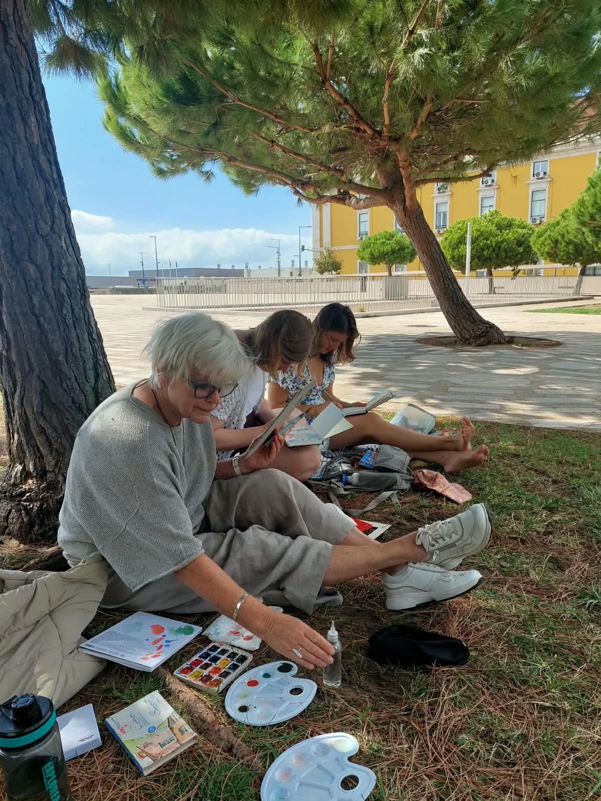 Participants sketching together during an outdoor urban sketching workshop in Alfama Lisbon