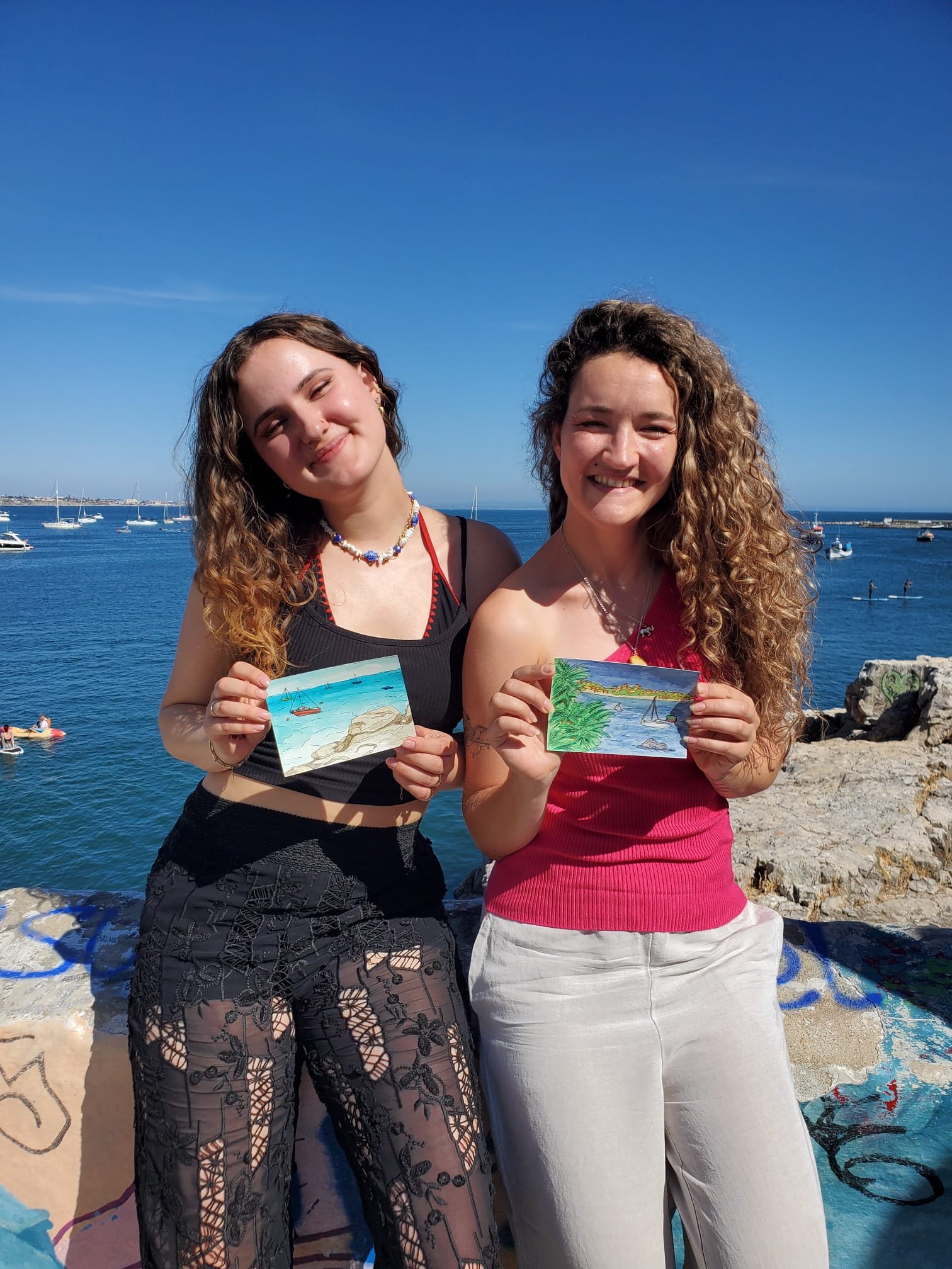 Participants sketching Cascais together during an outdoor urban sketching workshop
