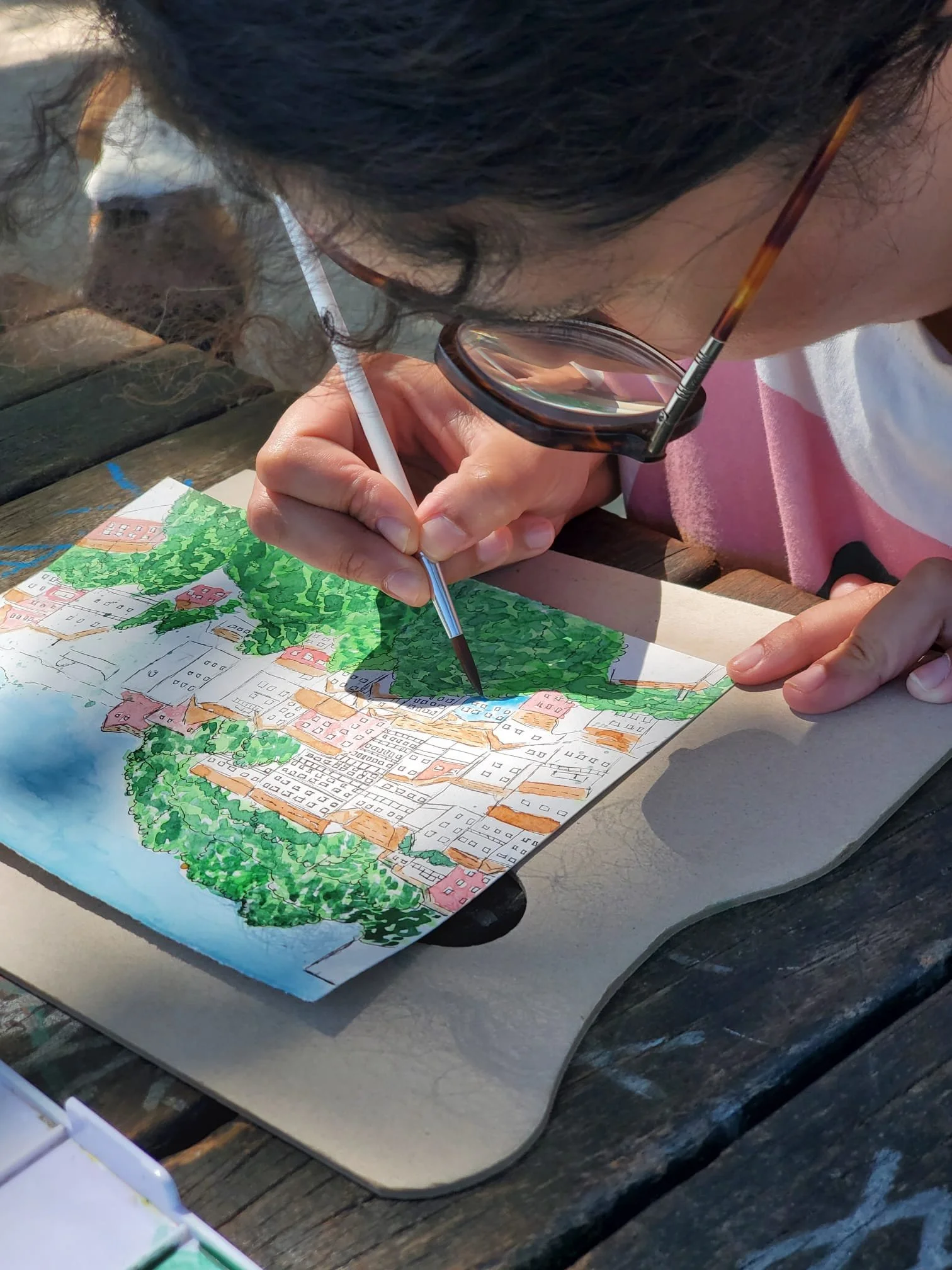 Participant sketching Miradouro da Graça during an urban sketching workshop in Lisbon
