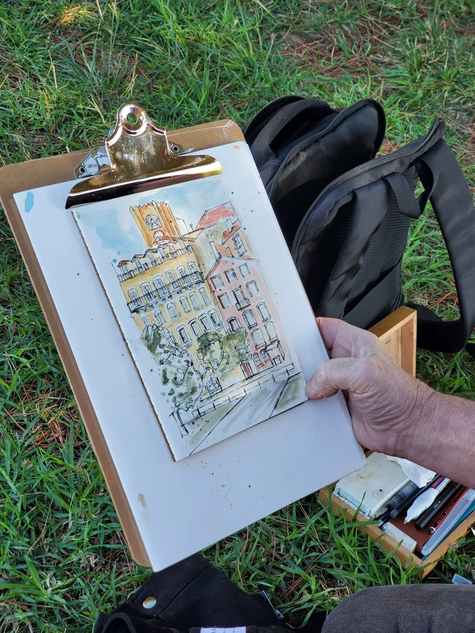 Participant sketching Alfama during an urban sketching workshop in Lisbon