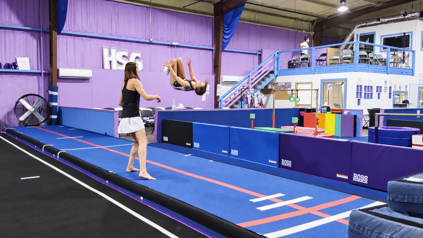 A girl and a man are taking a selfie in a gymnastics gym. Hot Springs Gymnastics | 112 Bluestone Ct. Hot Springs, Arkansas 71901