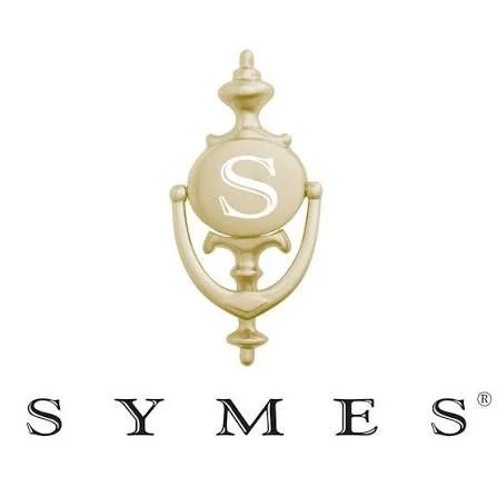 Smyes logo with a gold ornamental ornament and a large letter S on it