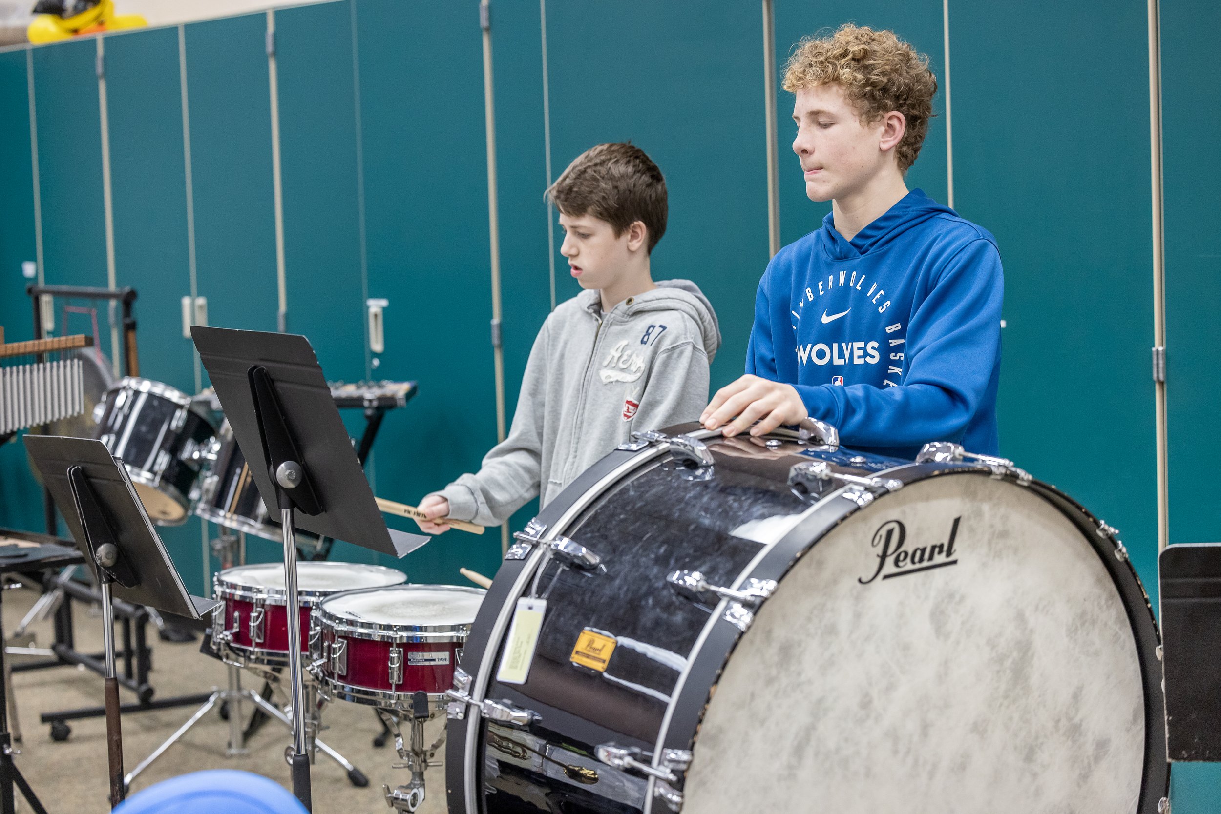Young teens playing instruments