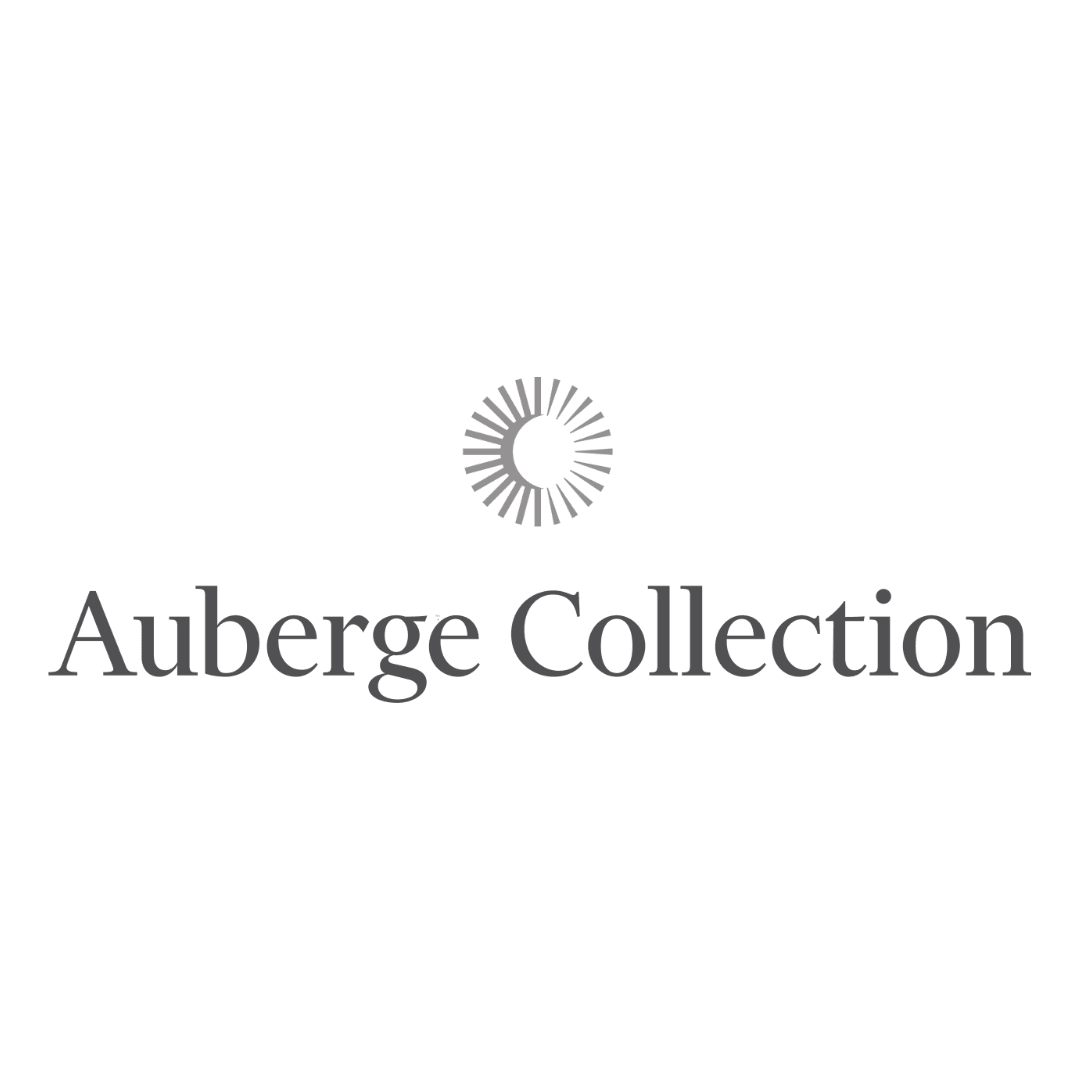 Logo for Auberge Collection with a circular sunburst graphic above the text