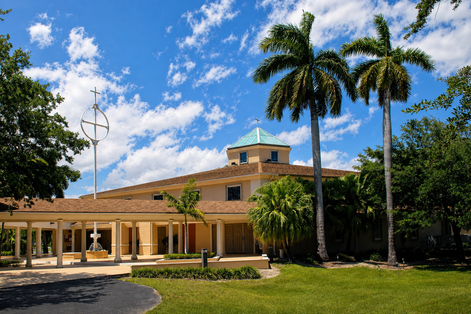 A church surrounded by palm trees under a partly cloudy sky.