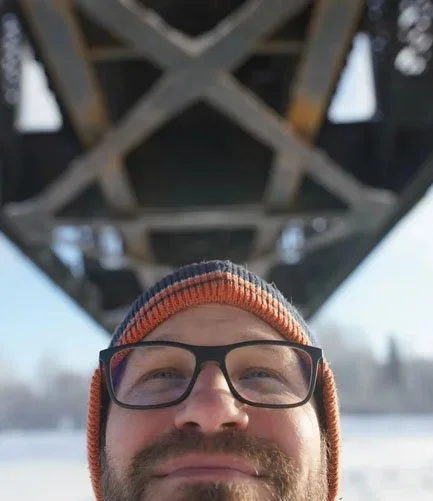 Portrait of Andy under a railroad bridge