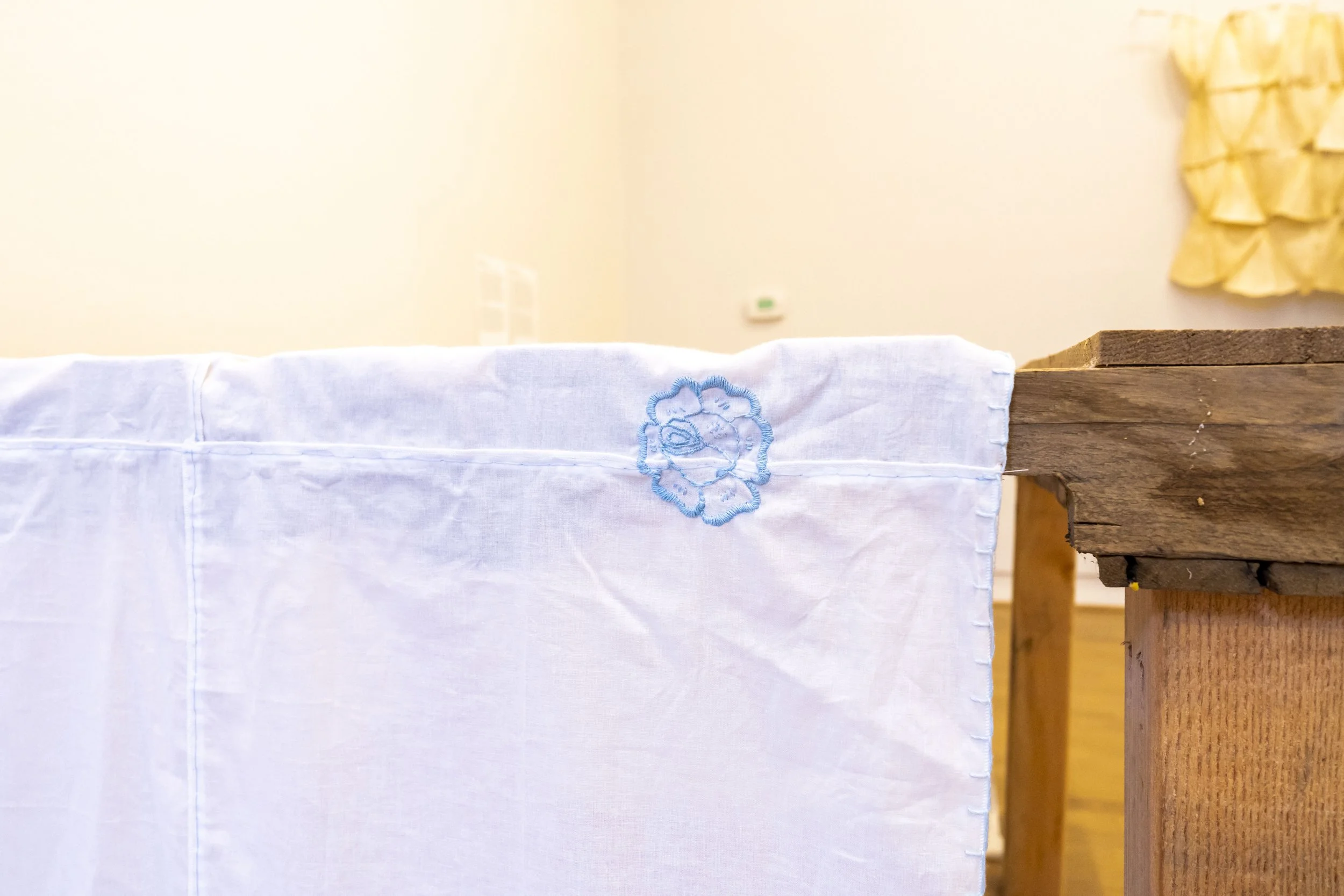 Obrere Internacional, 2022, Textile: 19 x 3.6 feet Table: 4 x 3.3 x 2.3 feet.
Exhibited at the Mexicali Biennial at the Santa Cruz Museum of Art and History (September 1 - December 31, 2022)
