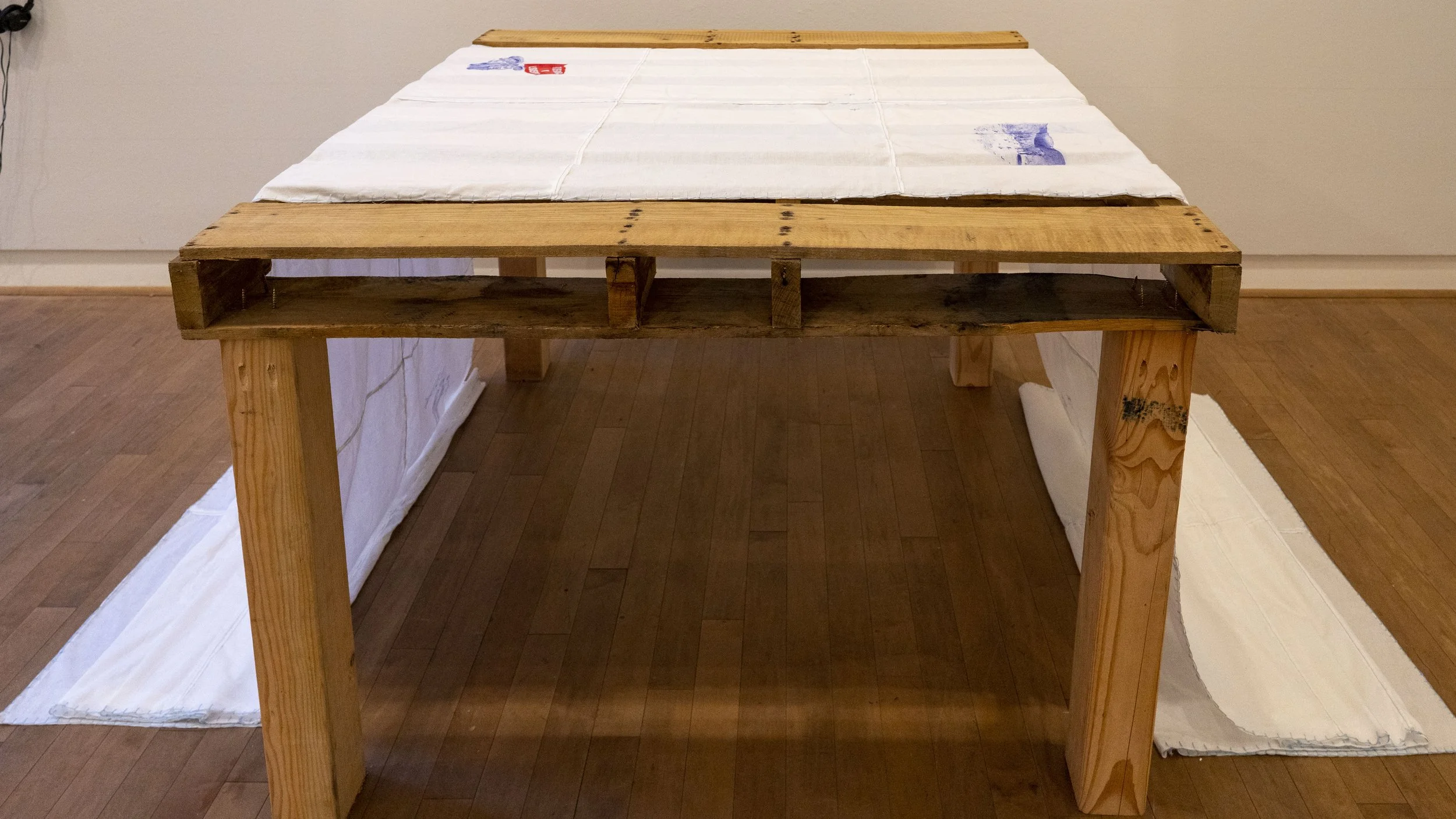Obrere Internacional, 2022, Textile: 19 x 3.6 feet Table: 4 x 3.3 x 2.3 feet.
Exhibited at the Mexicali Biennial at the Santa Cruz Museum of Art and History (September 1 - December 31, 2022)