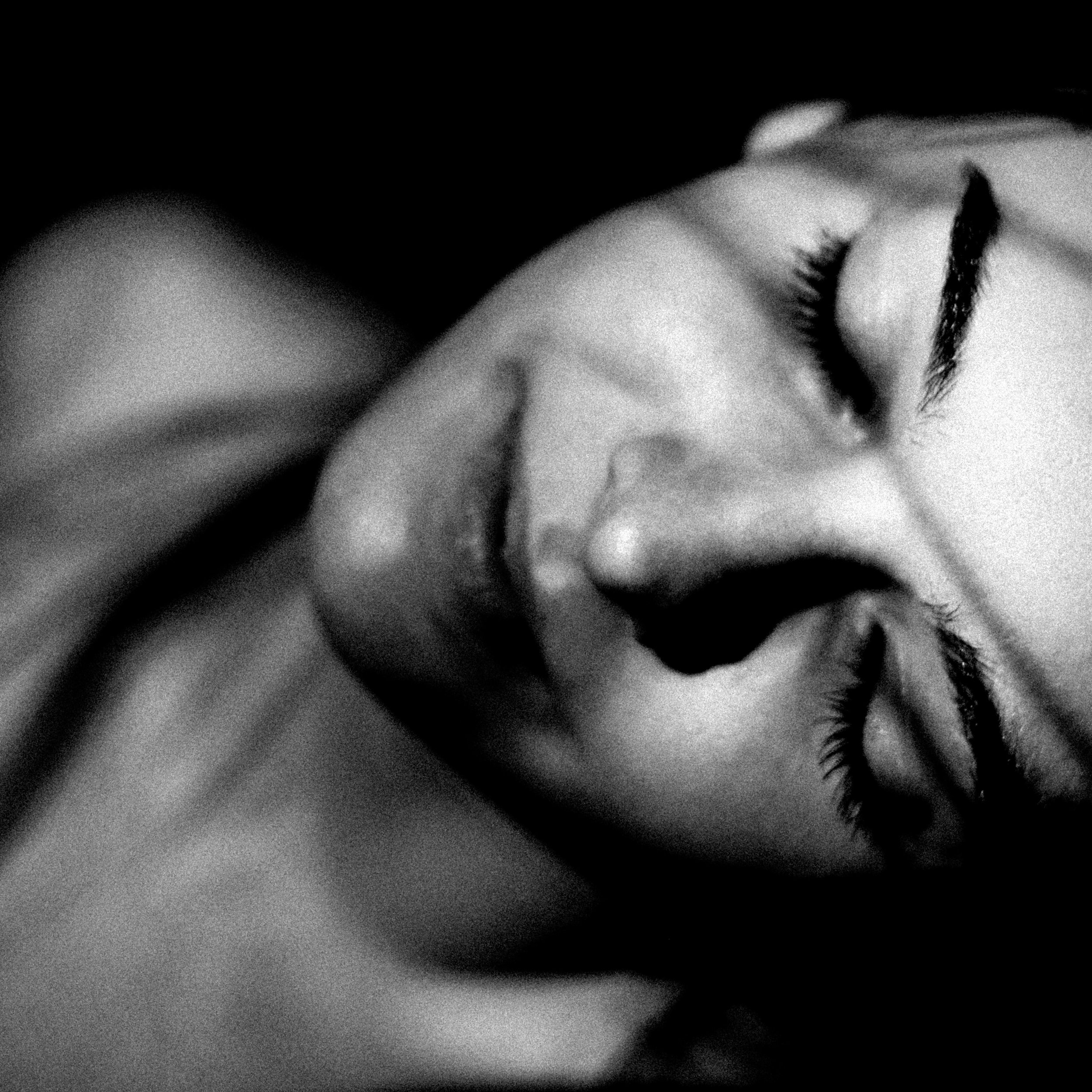 Close-up of a person's eye with long eyelashes, lying in a relaxed position.