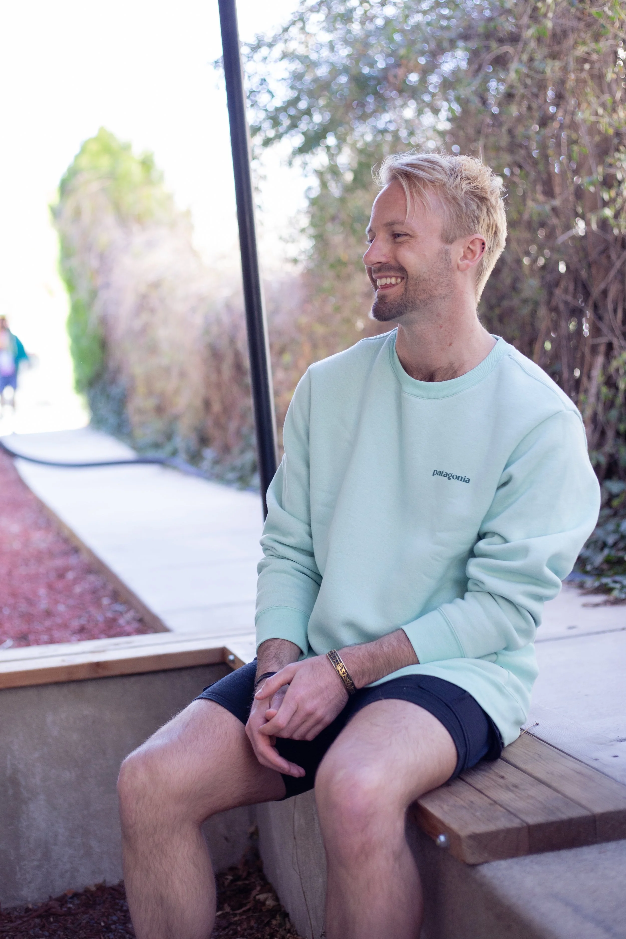 Adam Skyy, private yoga instructor, smiling outdoors