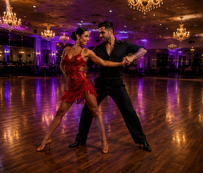 A couple dancing tango in a ballroom with chandeliers and purple lighting.