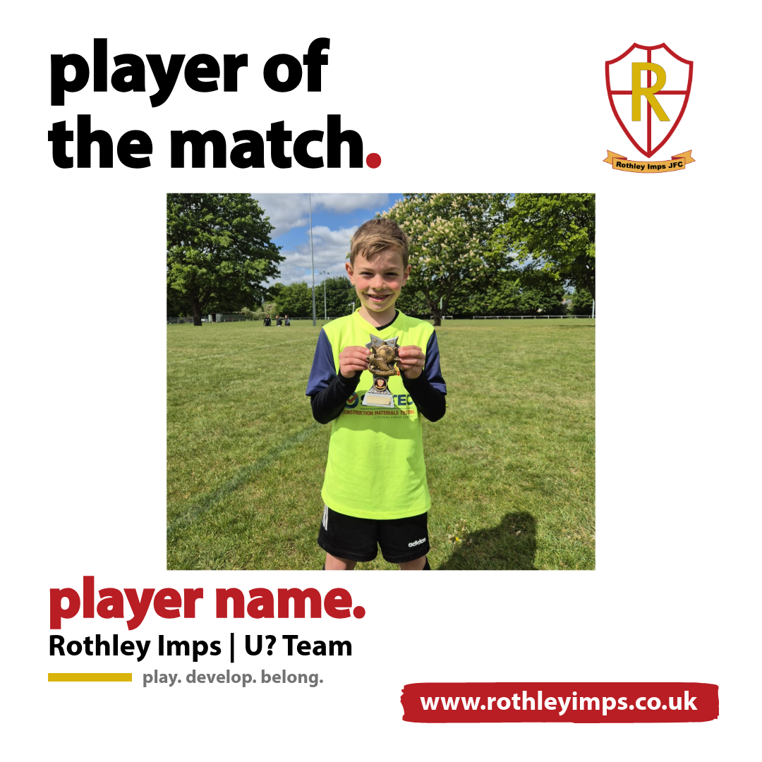 A young boy in a yellow and black sports uniform holding a trophy on a grassy field with trees and blue sky in the background.