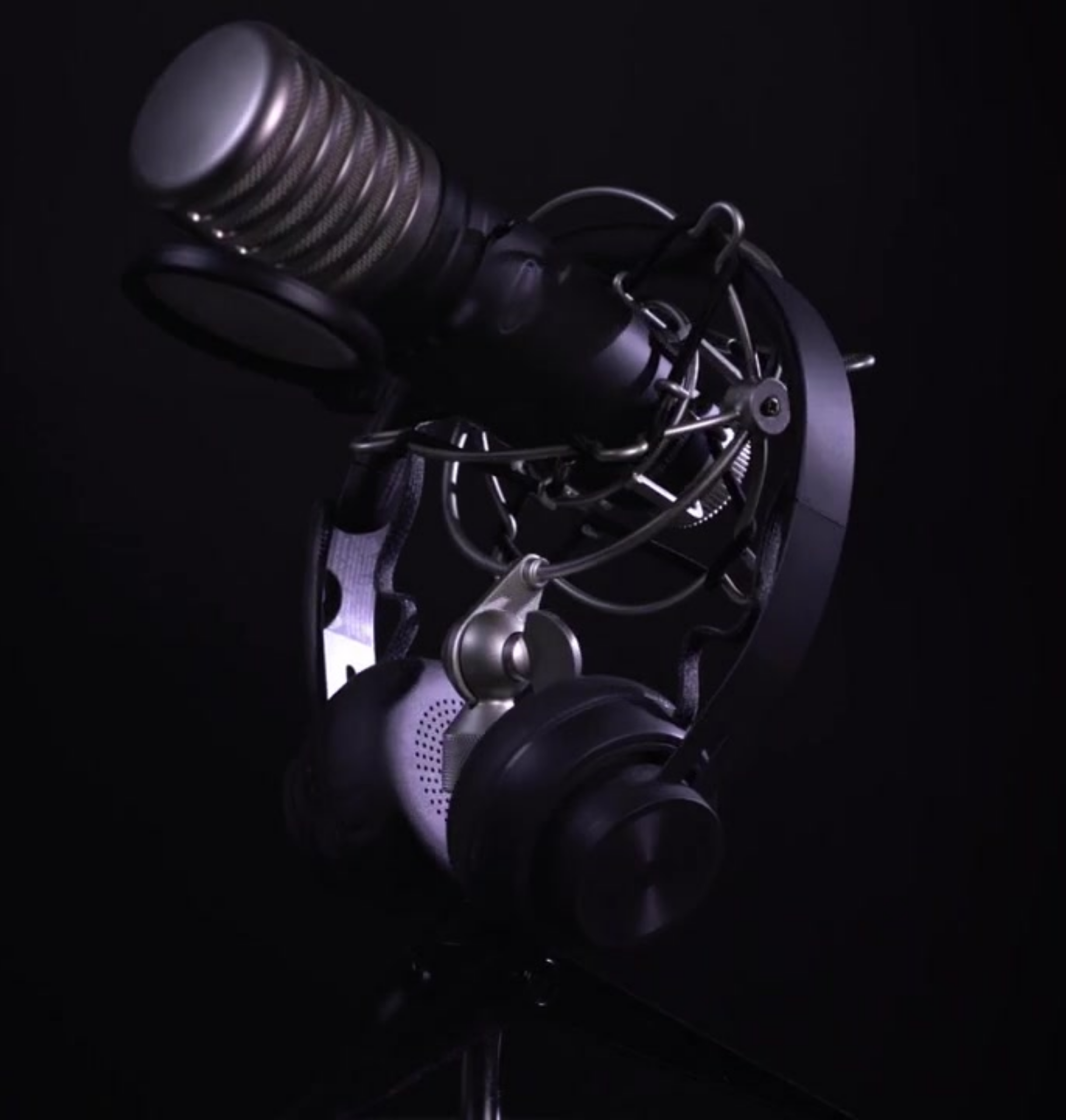 Photo of a podcast microphone and headphones