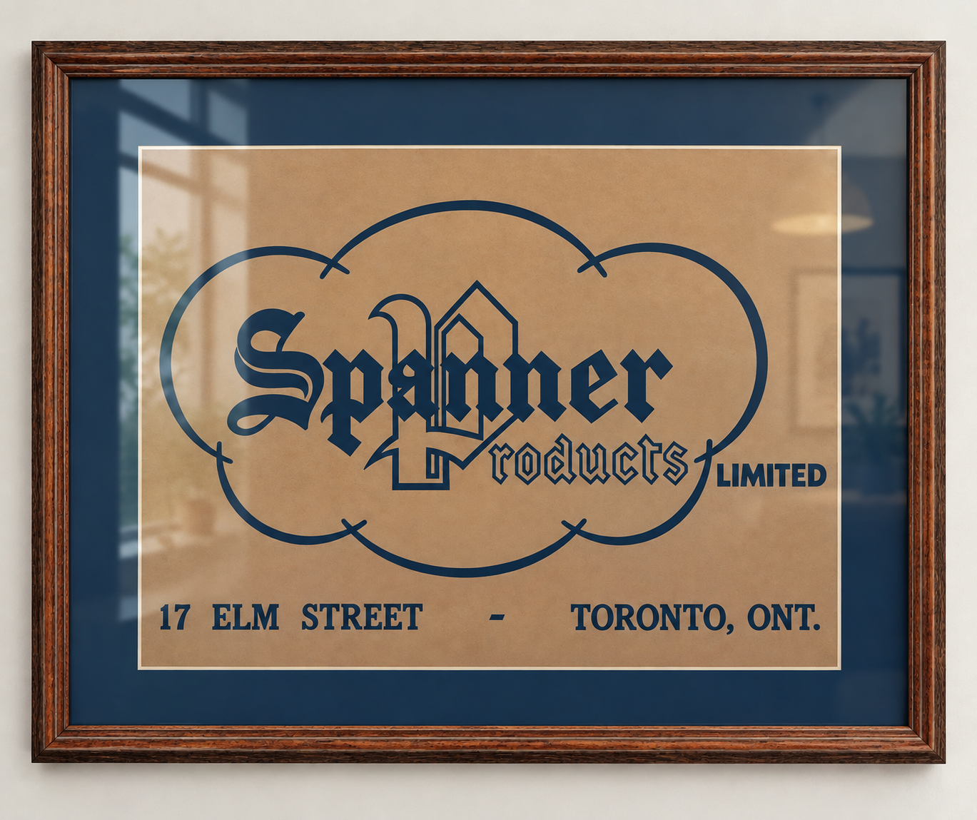 Framed vintage sign for Spanner Products Limited at 17 Elm Street, Toronto, Ontario, with a decorative logo and text.