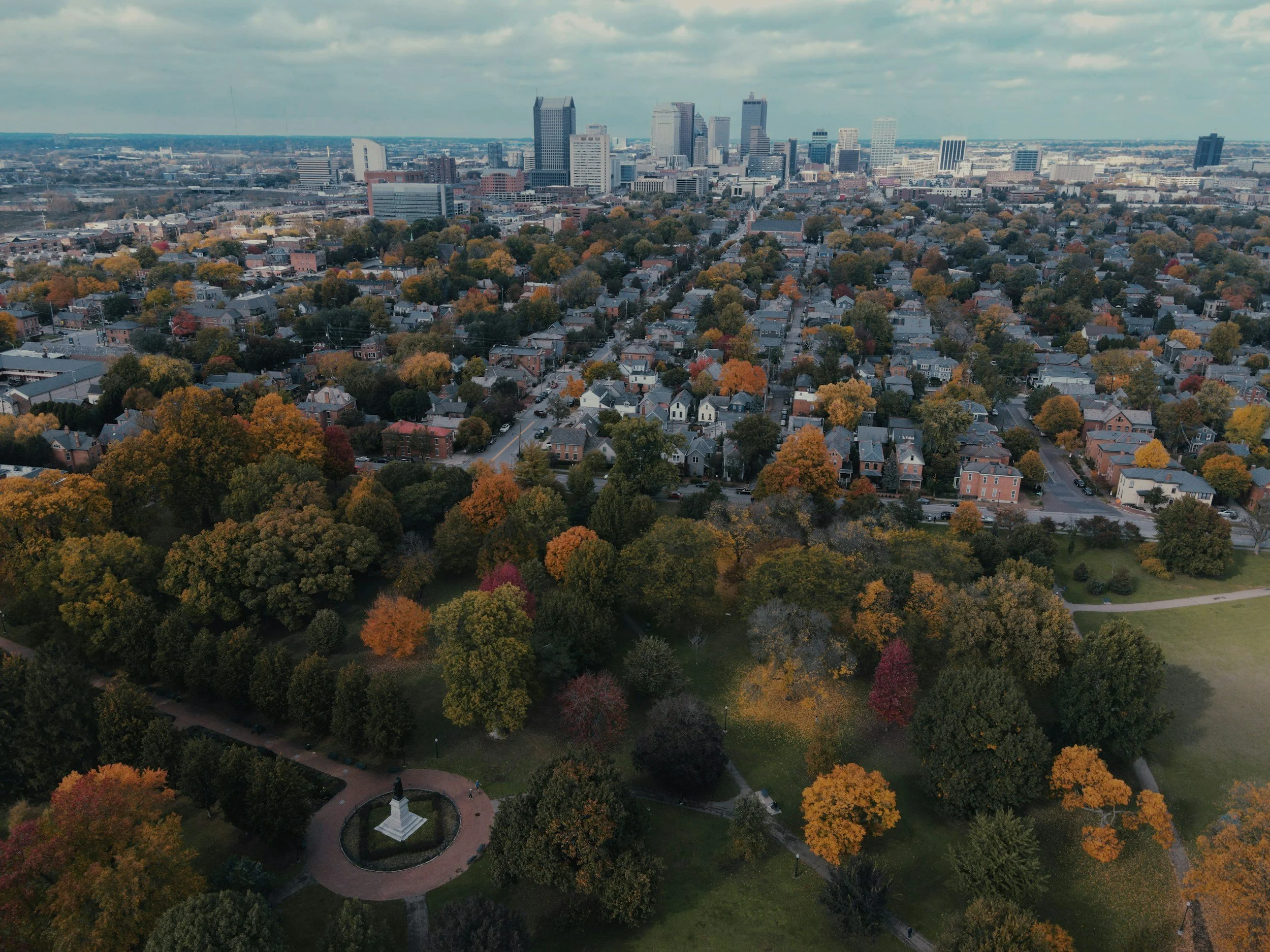 Aerial view of German Village in Columbus, Ohio with fall trees and the downtown skyline