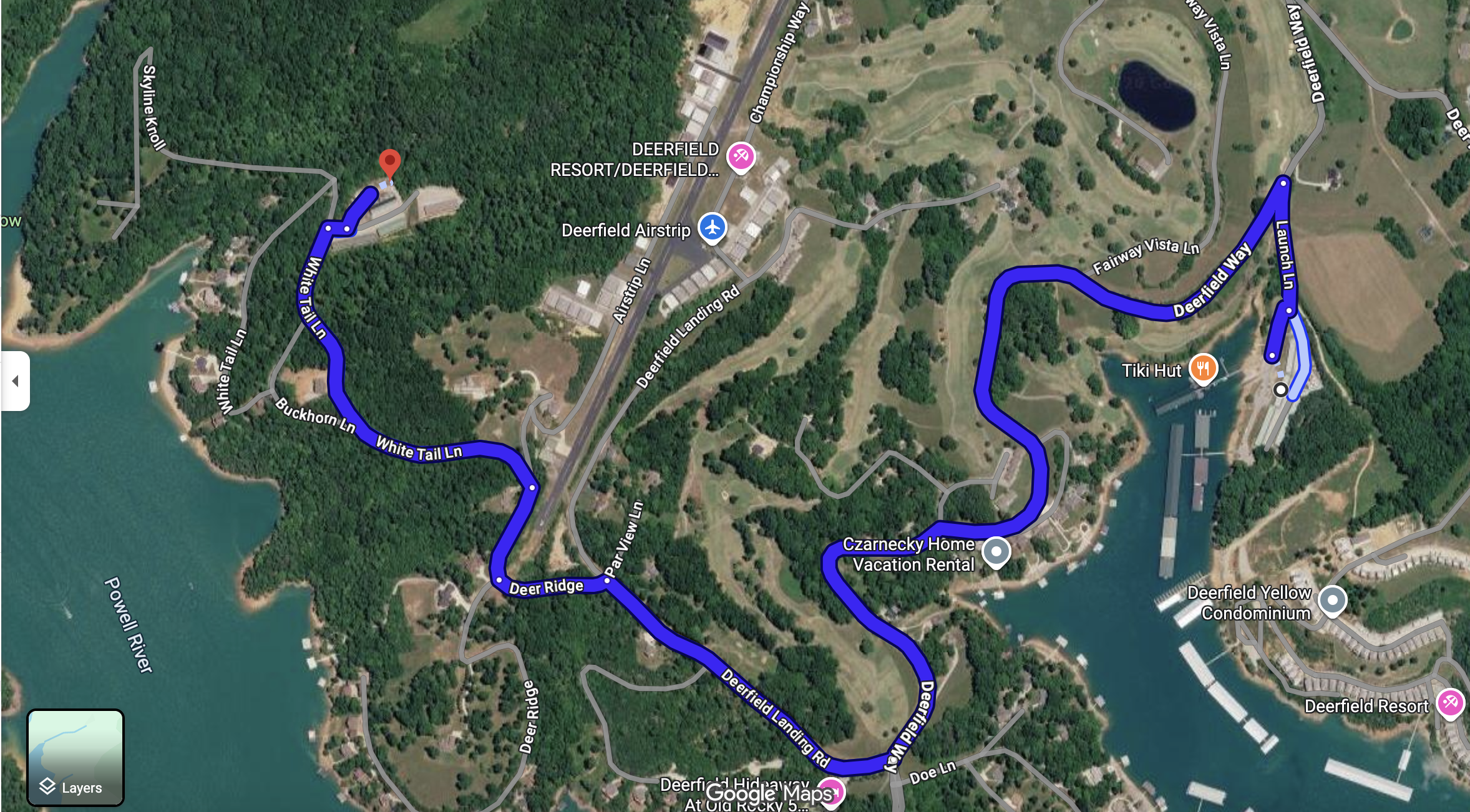 Satellite map showing Deerfield Lake and surrounding roads, including Deerfield Way, White Tail Lane, Buckhorn Lane, Deer Ridge, and other streets, with a marina on Deerfield Lake, nearby amenities, and green wooded areas.