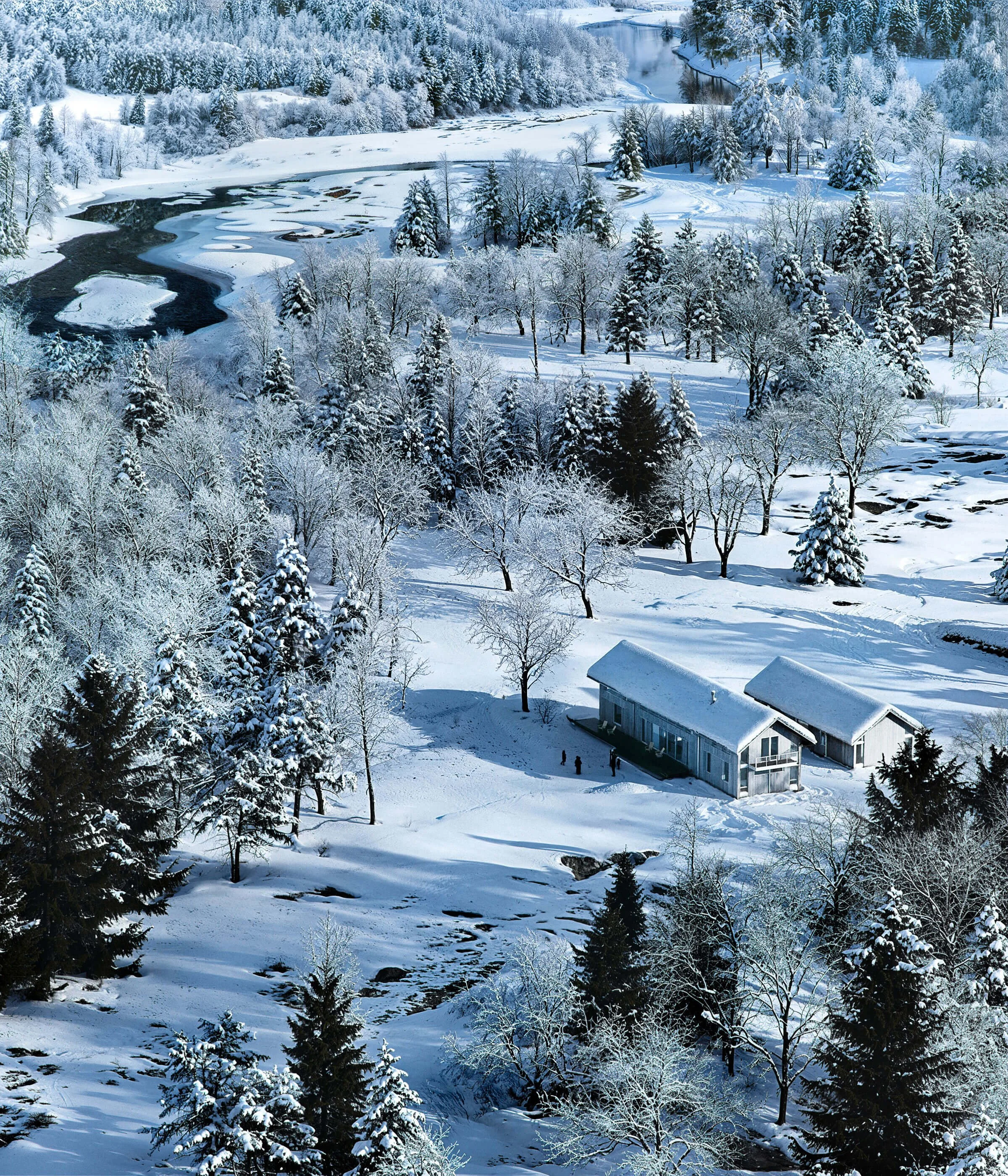 Aerial winter view of Big Wood River Ranch beside the snow-covered Big Wood River