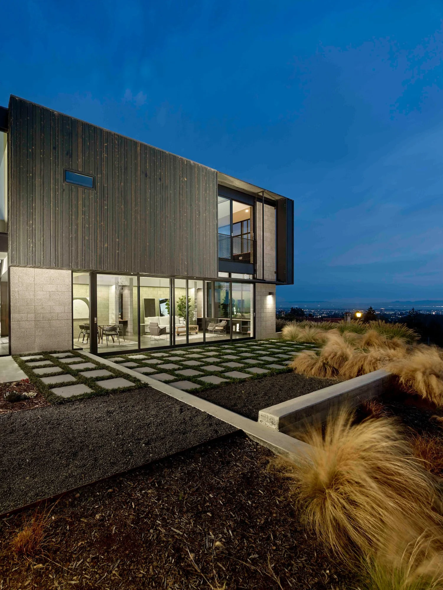 The Phoenix residence and garden at dusk overlooking the lights of San Francisco Bay
