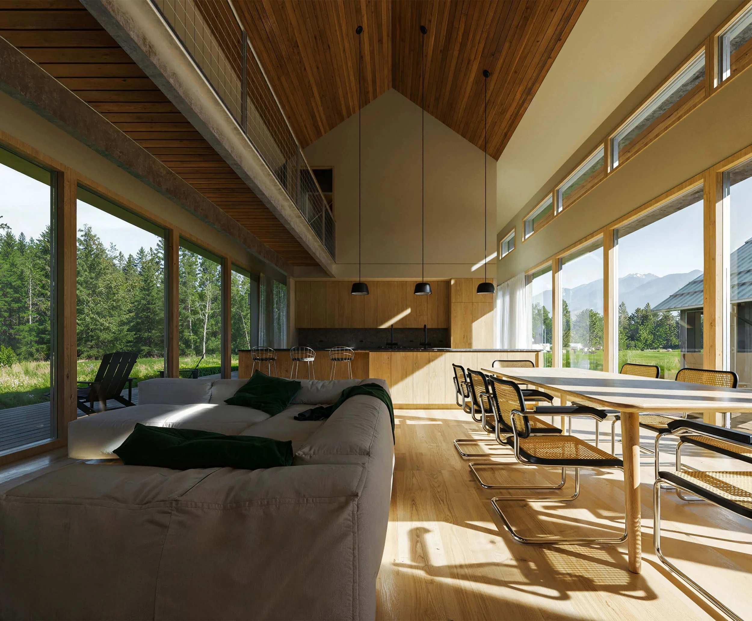 Double-height living, dining, and kitchen space opening to the landscape at Big Wood River Ranch