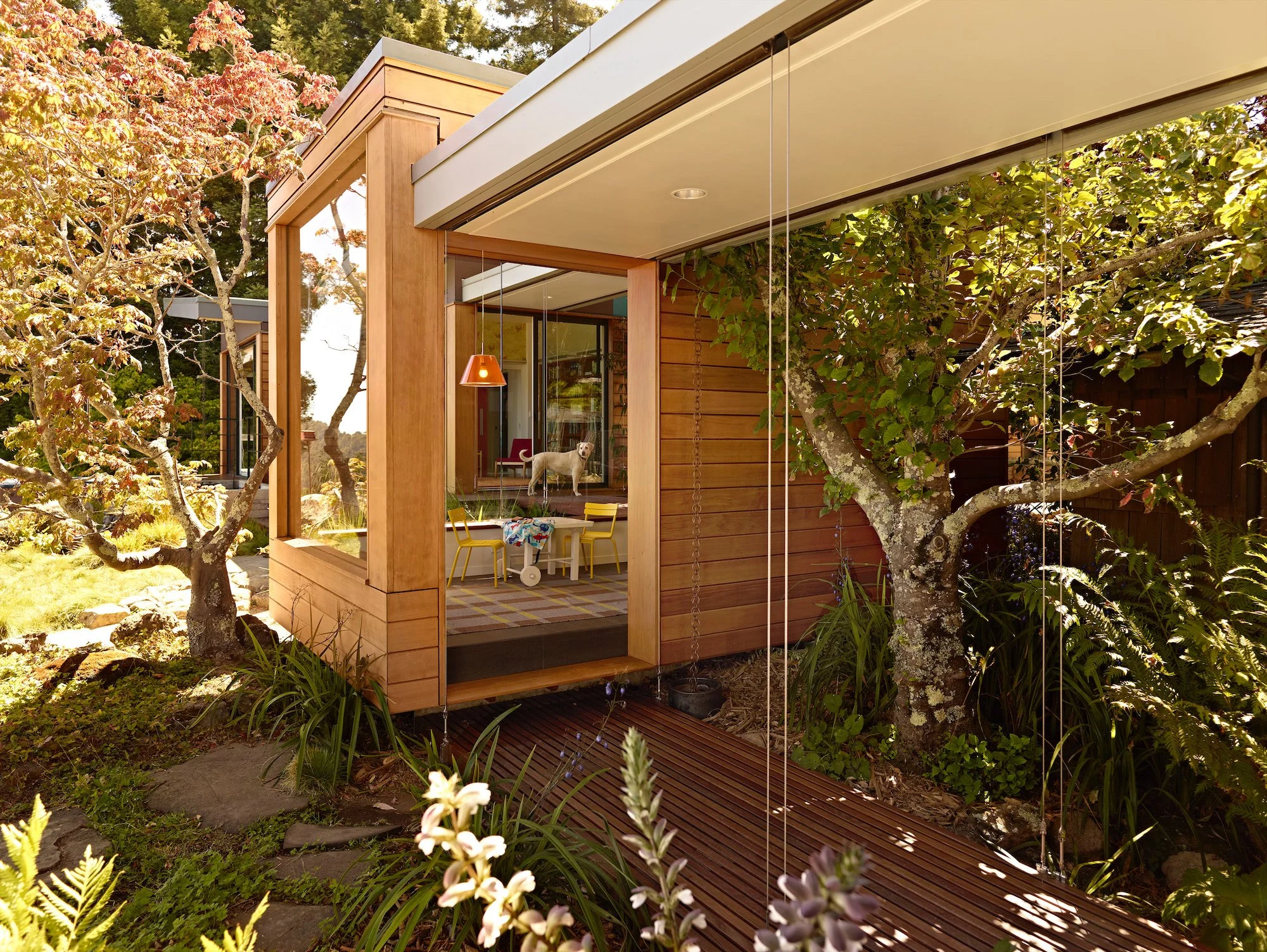 Open-air bridge connecting the Butterfly House pavilion through the garden
