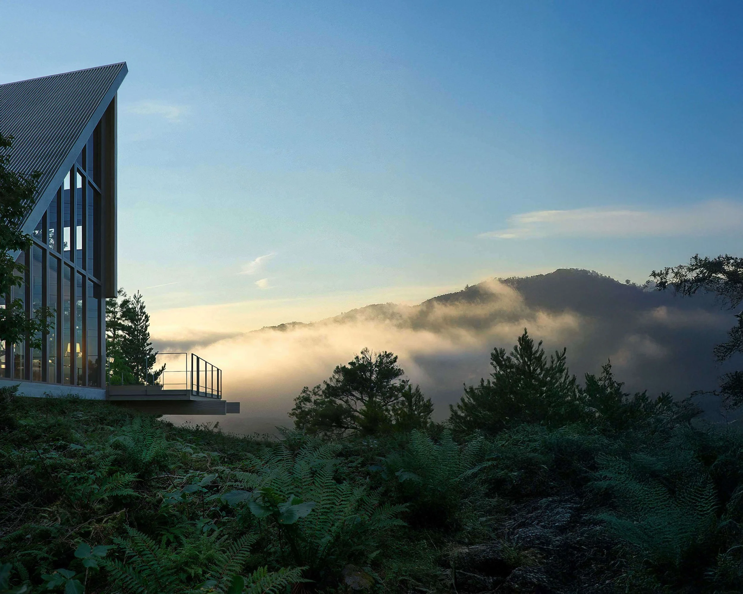 The Italic A house overlooking a foggy San Geronimo Valley from its forested West Marin hillside