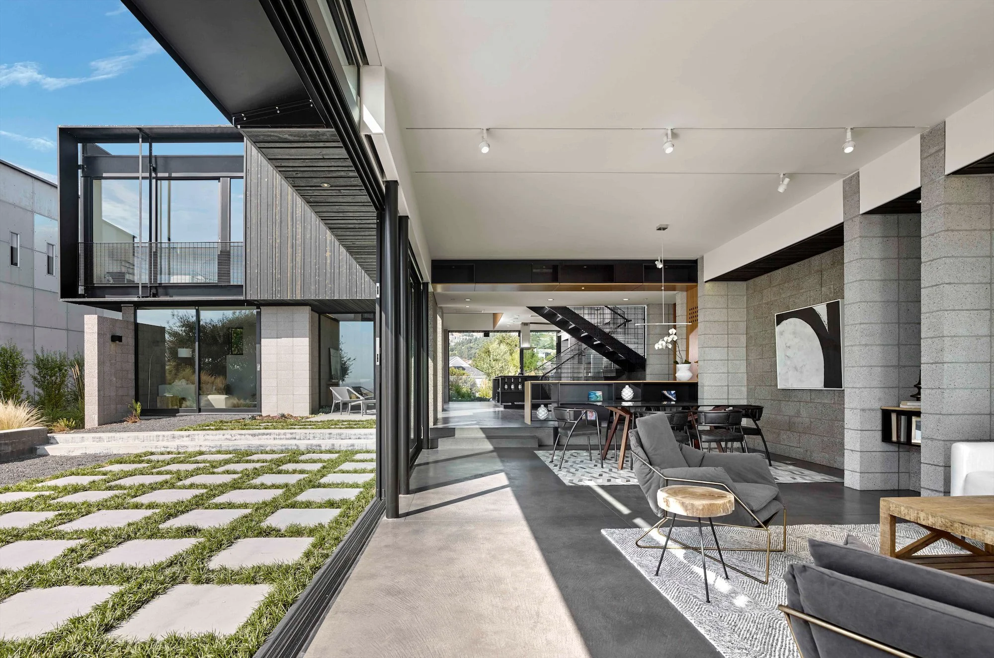 Living space opening completely to a landscaped courtyard at The Phoenix residence