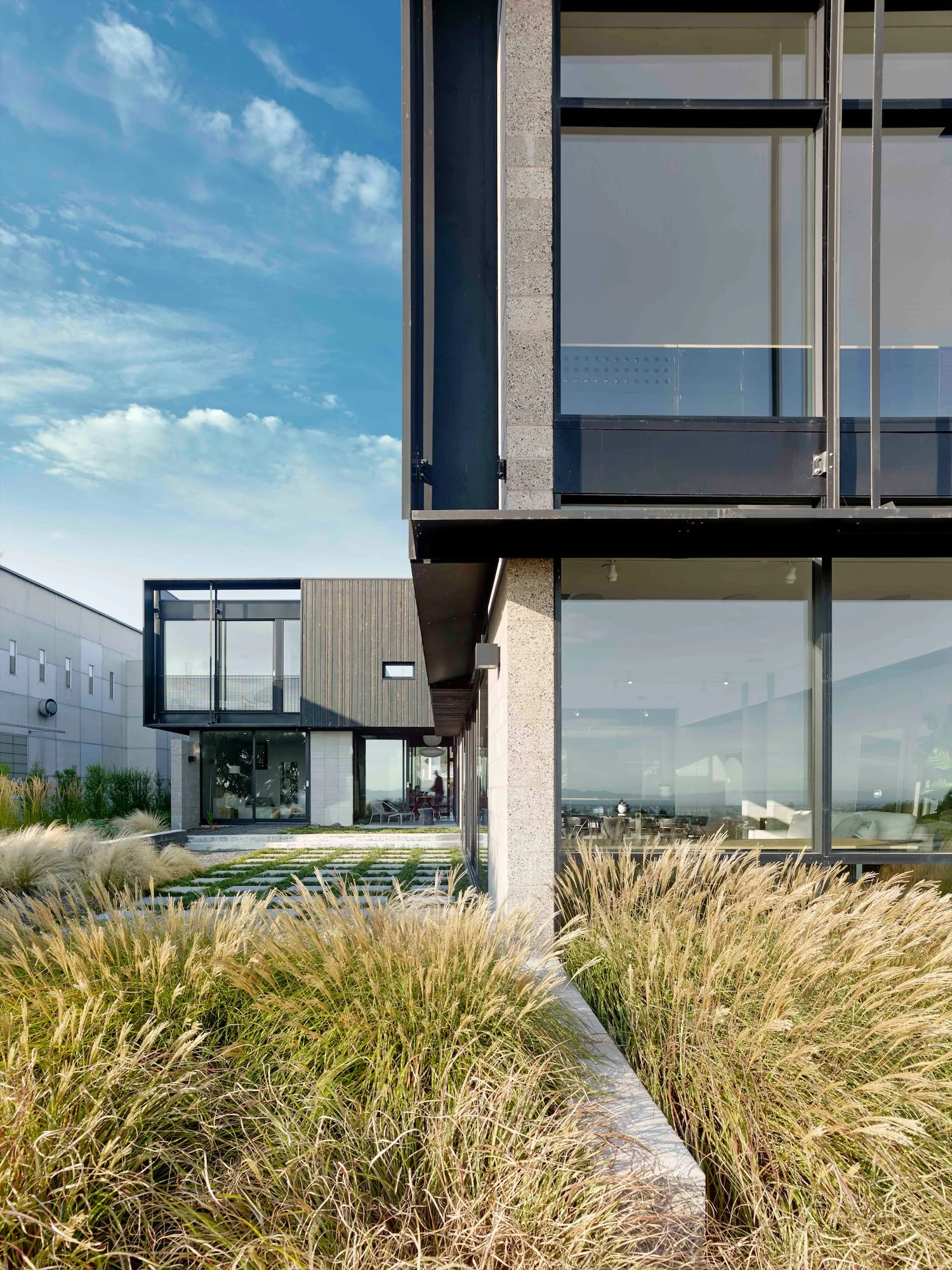 Garden courtyard framed by the projecting volumes of The Phoenix residence