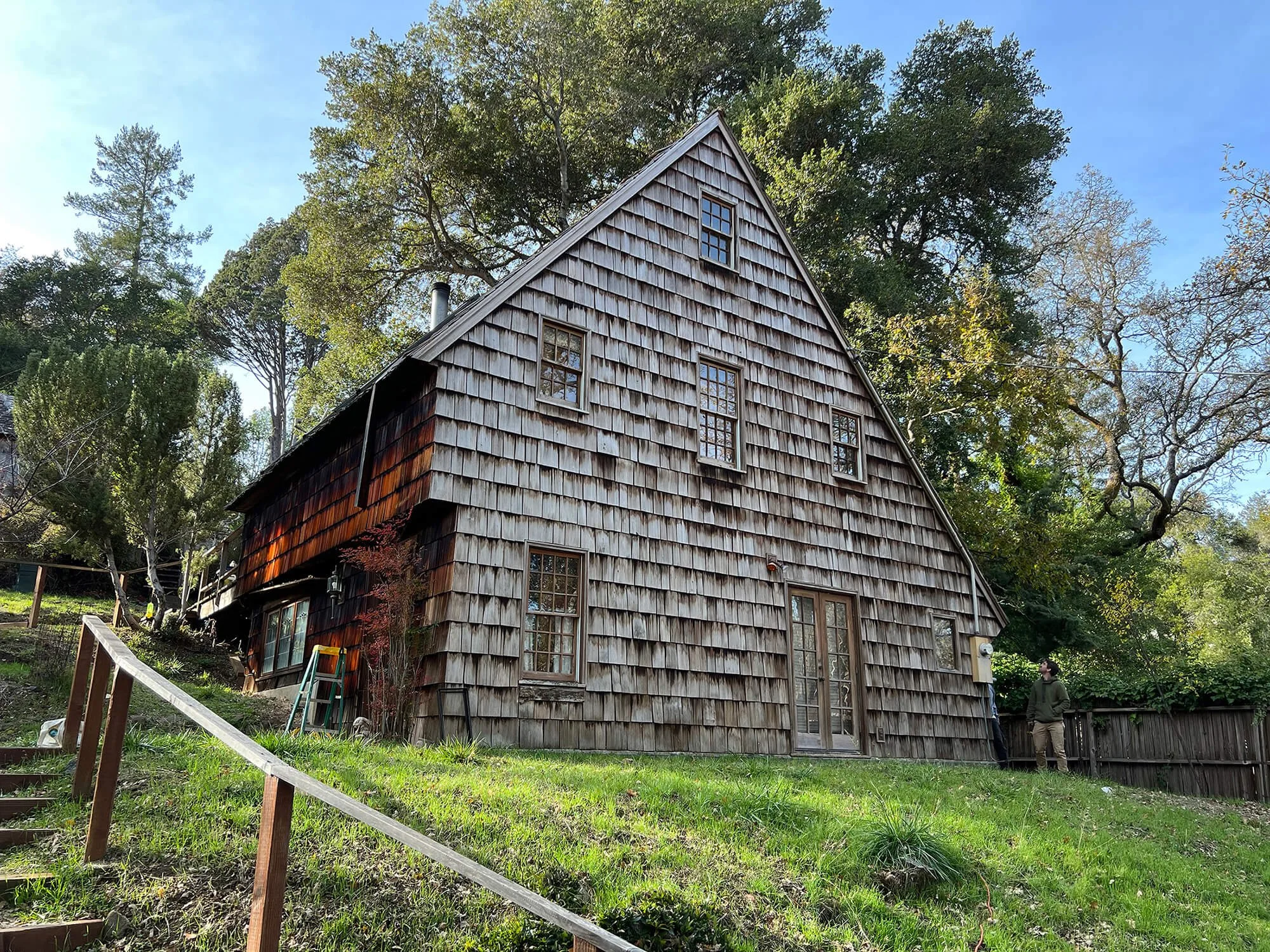West Marin saltbox house before restoration, with weathered cedar shingles and deteriorated exterior finishes