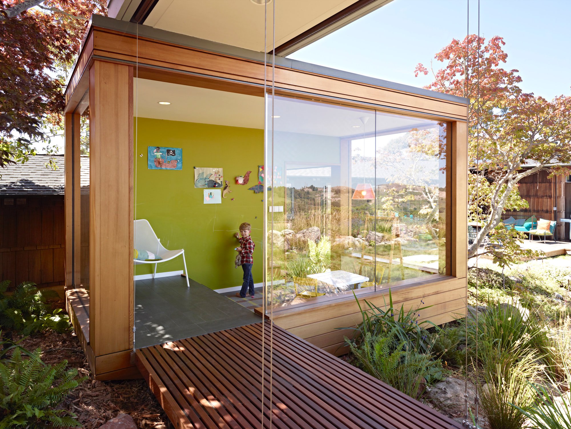 Glass-walled Japanese-inspired tea room connecting the Butterfly House addition to the garden