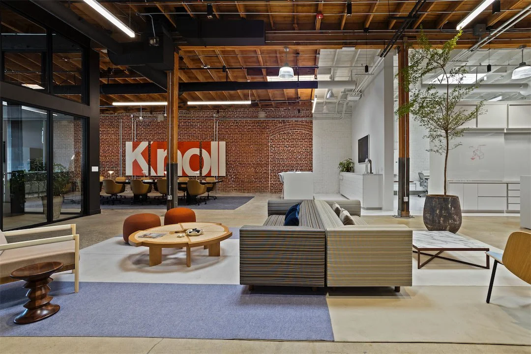 Pivot Interiors Design Center combining furniture showroom, workplace, and exposed historic brick structure in Los Angeles