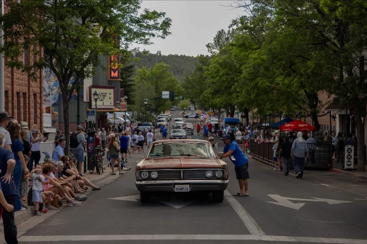 Great Race participants and spectators in a host community
