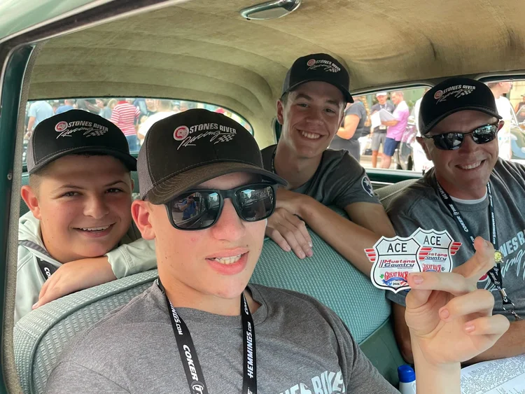 Young Great Race participants together inside a vintage vehicle