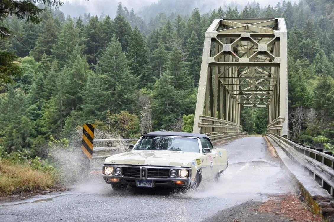Great Race participants and vintage vehicles during the event