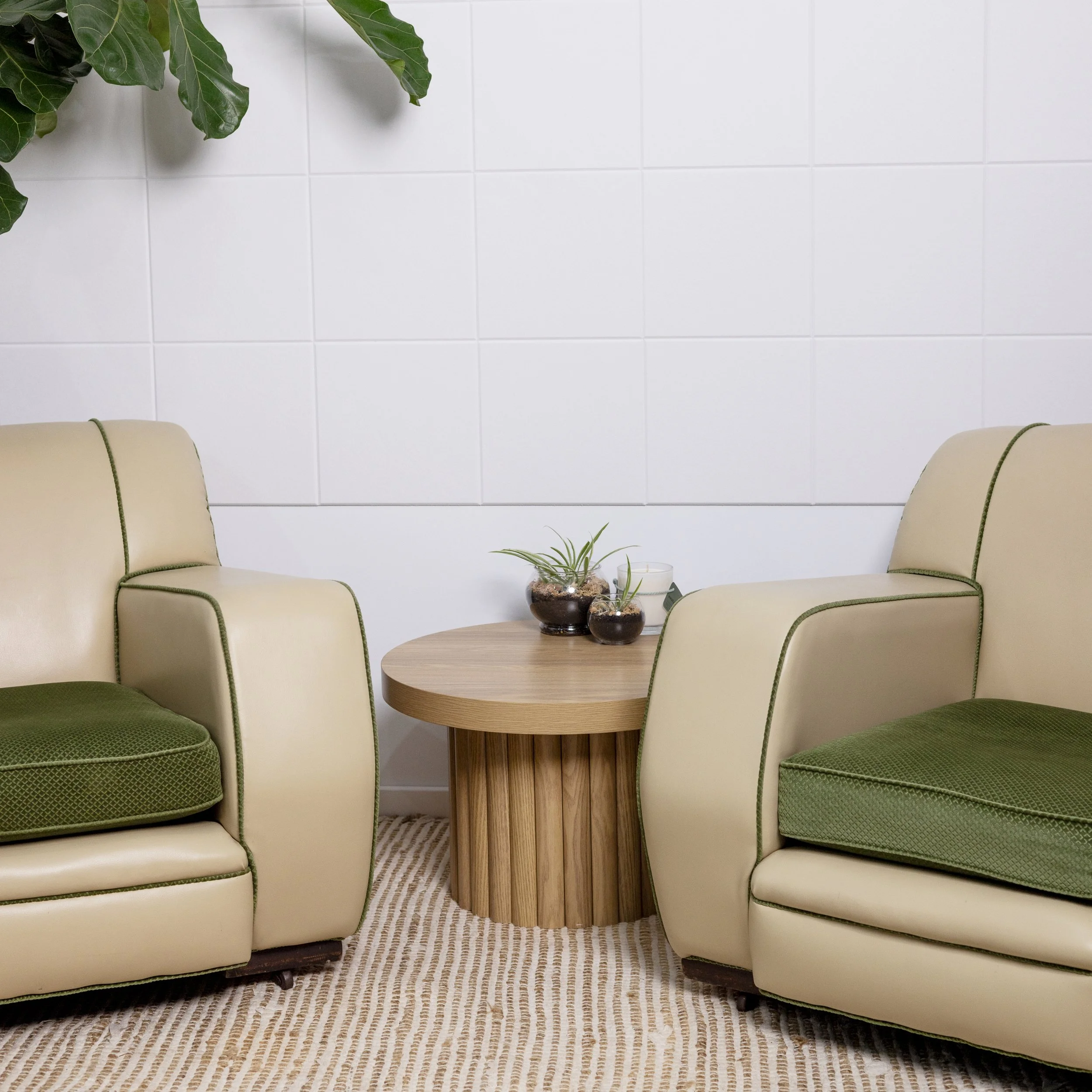 Relaxed two-person podcast set with armchairs and greenery inside the G Studios Podcast Studio