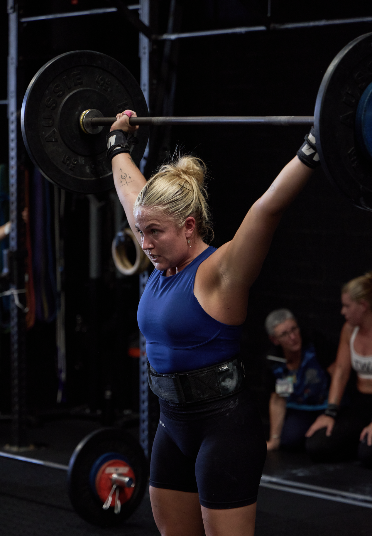 Sports photography of a female athlete weightlifting, captured by the G Studios content team