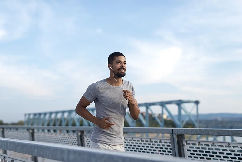 A man jogging outdoors after a healthy checkup visit in Redding, CA at walk-in clinic Integrity Medical Center