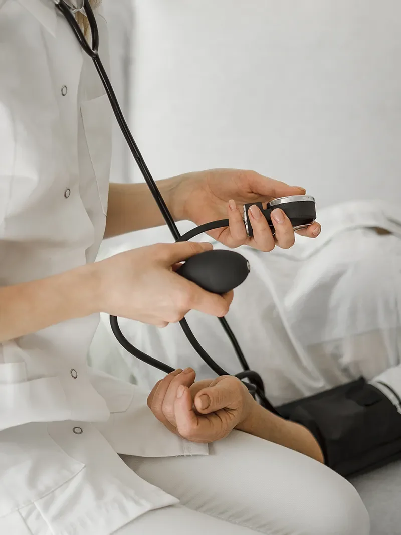 Family medical provider taking blood pressure during preventative care visit in Redding CA at Integrity Medical Center