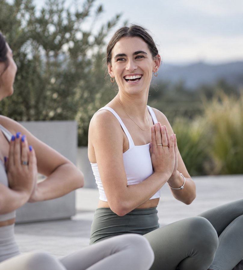 Smiling woman outdoors after a yoga session