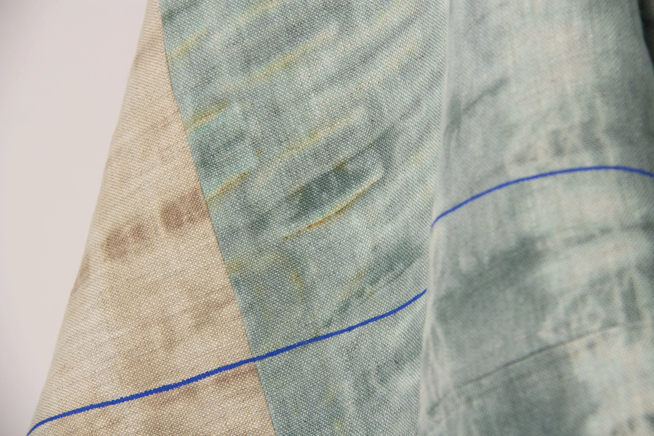 Details - Showcasing rust marks created using metal clips in the dyeing process