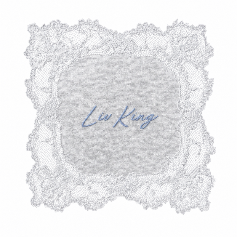 A decorative card with a lace border and the name 'Liv King' written in blue script in the center.
