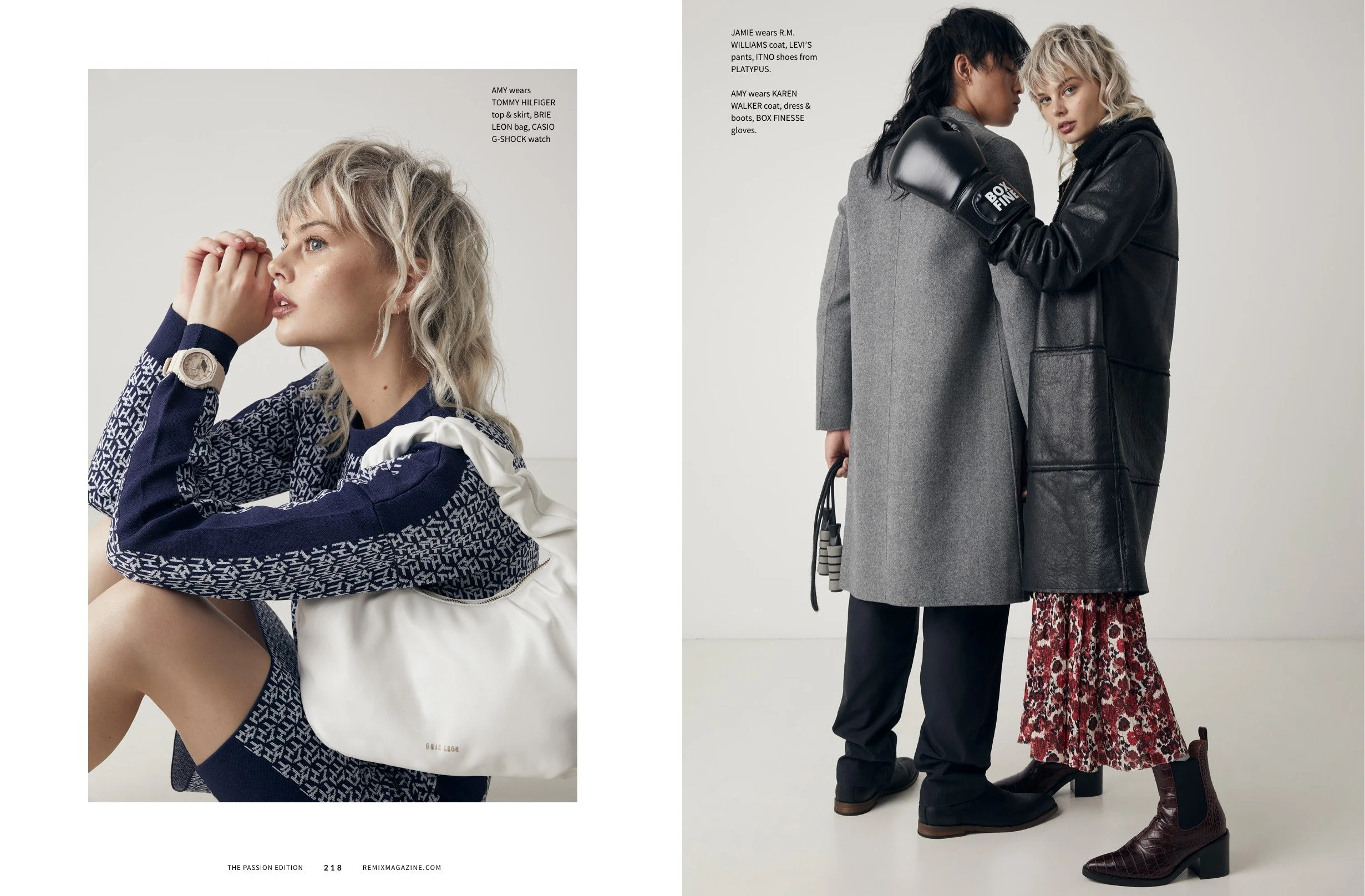 Two women, one with black hair and the other with blond hair, are dressed in fashionable winter clothing. The woman with blond hair is wearing a navy and white patterned Tommy Hilfiger top and skirt with a white bag, and the woman with black hair is wearing a gray coat and black boots with boxing gloves. The photo has a minimalist studio setting background.