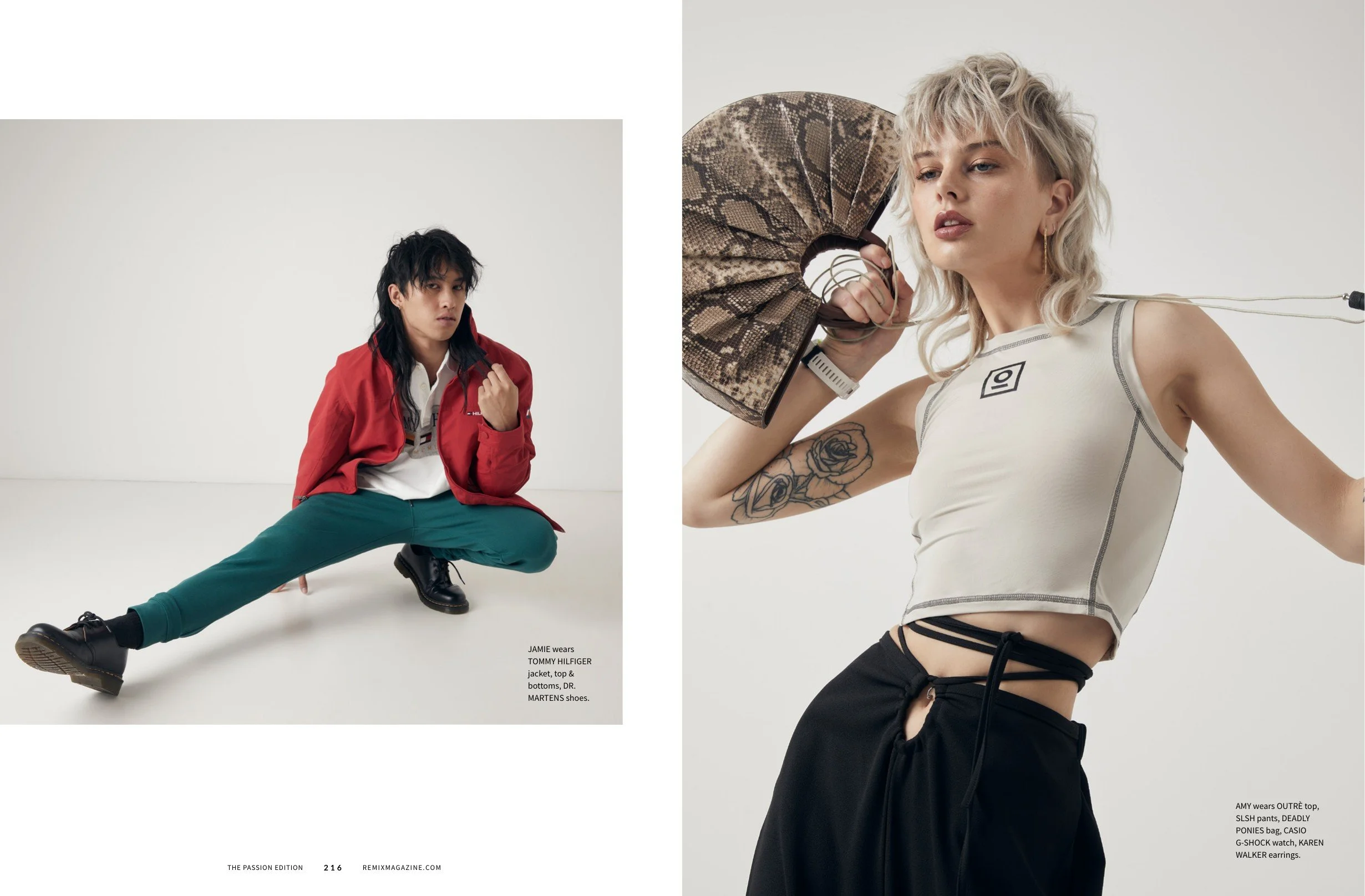 A fashion photoshoot featuring a male model in a red jacket and teal pants on the left, and a female model in a white top and black pants holding a snakeskin purse on the right, both against a plain white background.